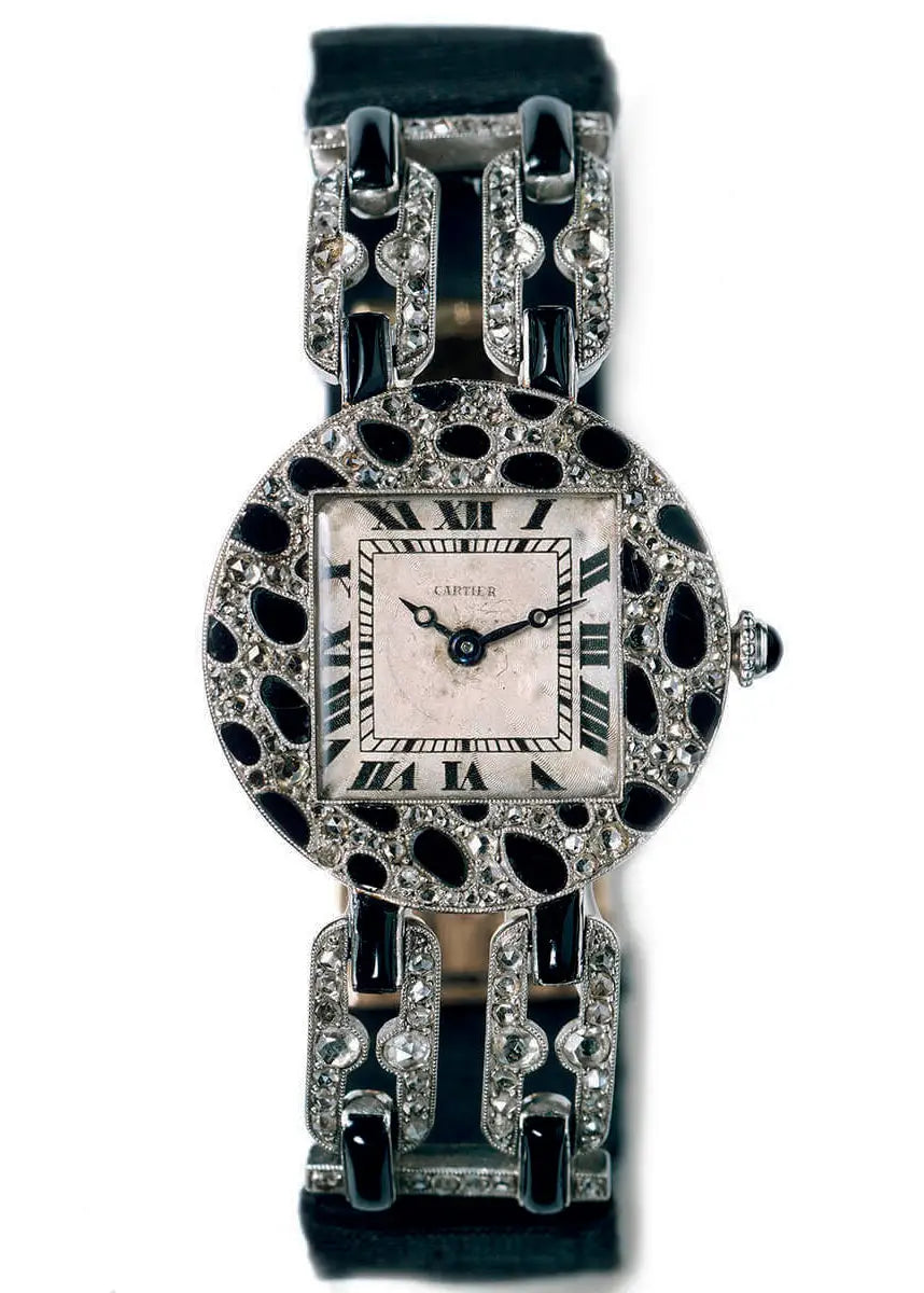 Cartier Panther Art Deco platinum wristwatch from 1914 with panther spots in onyx and rose-cut diamonds; it boasts a diameter of 24.6 mm