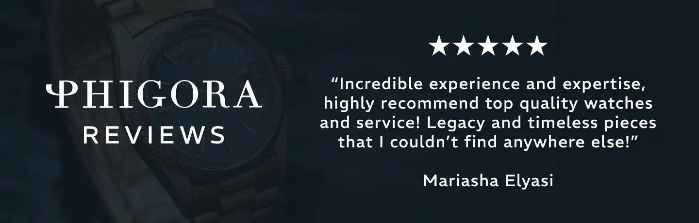 A sleek, dark-toned watch with a metallic band and a classic round face.