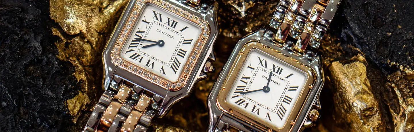 Two elegant cartier santos watches with square faces, roman numerals, and diamond-encrusted bezels on a two-tone metal band.